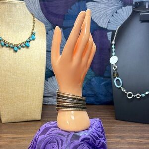 Elegant Gold and Black Multi-Strand Bracelet